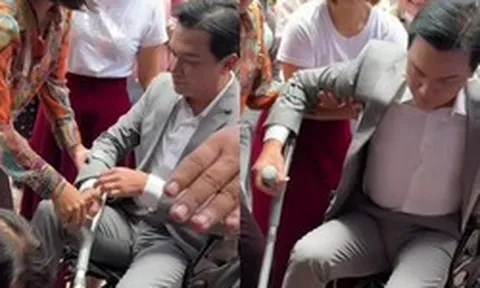 Mạnh Quỳnh về Việt Nam, phải ngồi xe lăn và chống nạng